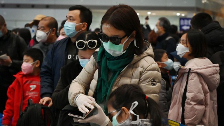 Des passagers de vol ont été vus portant des masques de protection à Pékin
