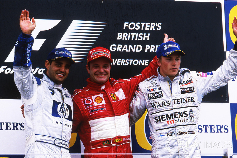Le podium: Juan Pablo Montoya, Williams, deuxième; Rubens Barrichello, Ferrari, vainqueur; Kimi Raikkonen, McLaren, troisième