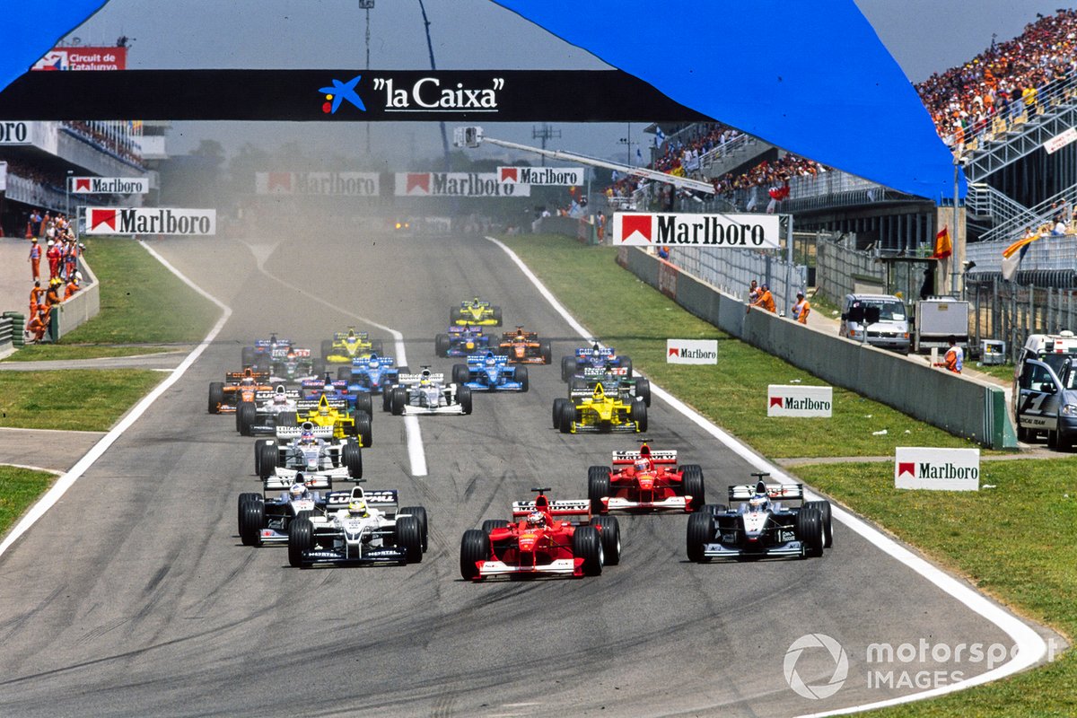 Michael Schumacher, Ferrari F1-2000, mène Ralf Schumacher, Williams FW22 BMW, Mika Häkkinen, McLaren MP4-15 Mercedes, Rubens Barrichello, Ferrari F1-2000, David Coulthard, McLaren MP4-15 Mercedes, au début