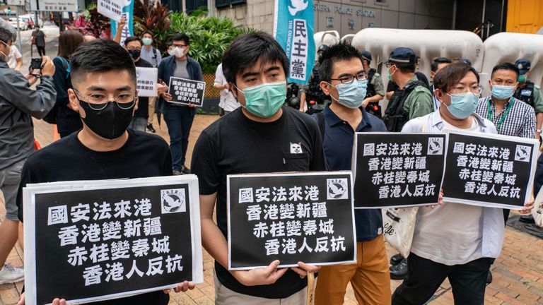 Des militants en faveur de la démocratie lors d'un rassemblement en réponse à une proposition de promulguer une nouvelle législation sur la sécurité à Hong Kong
