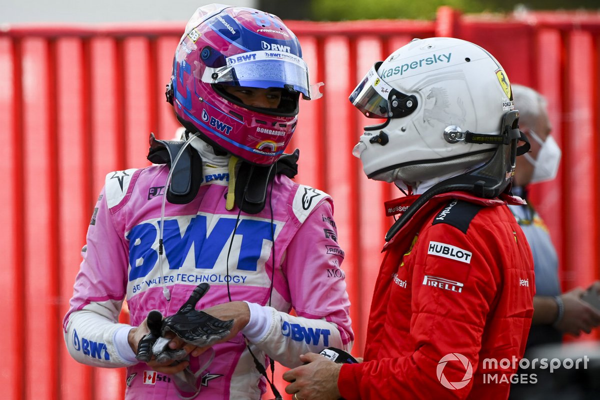 Lance Stroll, Racing Point et Sebastian Vettel, Ferrari, discutent au Parc Ferme après la course