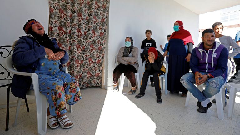 Les proches de Brahim Aouissaoui se sont réunis à la maison familiale à Thyna, une banlieue de Sfax en Tunisie, avec sa mère, Gamra Issawi (à gauche)