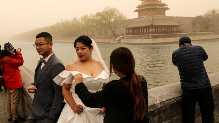 La tempête n'a pas empêché un couple de se marier près de la Cité Interdite